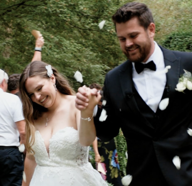 Couple celebrating with flower petals